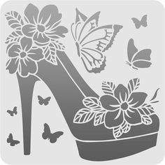 a high heeled shoe with flowers and butterflies on the side, surrounded by butterflies