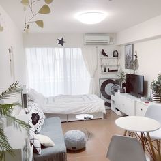 a bedroom with a bed, desk and television in it's centerpieces