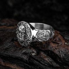 This stainless steel ring features a central Odin's head and Celtic knot decoration with engraved Valknut designs down each side. They will resonate with the Viking in you. Odin, ruler of all things, is the head god in Norse mythology and this ring symbolizes his power and strength. Wear this ring as a physical reminder of your own inner strength and wisdom. Viking Rings, Viking Culture, Viking Ring, Head Ring, Stainless Steel Ring, Viking Jewelry, Norse Mythology, Themed Jewelry, Stainless Steel Rings