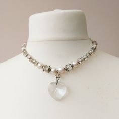 - Lovely bead necklace made from a selection of glass beads, both faceted and smooth, faux pearls and a central large heart shaped crystal pendant.  - Vintage 1940's item.  - In very good condition, (the pendant has a very small chip on one of it's side, ca 1mm, can only be seen very close to and cosmetic). - Necklace Dimensions: Length 45.5 including extender. Delivered by Royal Mail. First class - tracked and signature upon delivery. Gift wrapping available, includes card & envelope. See image and details under Gift wrapping. Crystal Heart Pendant, Large Heart, Wedding Jewellery Necklace, Large Crystals, Crystal Heart, Wedding Necklace, Bead Necklace, Crystal Pendant, Vintage Necklace