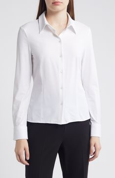 This fitted shirt features plenty of stretch to keep you moving forward, and asymmetric mitered cuffs to keep you fashion-forward. 23 1/2" length Front button closure Spread collar Long sleeves with mitered one-button cuffs 100% polyamide, 13% elastane Machine wash, line dry Made in Turkey Classic Stretch Office Wear Blouse, Classic Fitted Office Blouse, Classic Fitted Blouse For Office, Classic Fitted Blouse For Business Casual, Elegant Stretch Shirt For Office Wear, Modern Fitted Blouse For Business Casual, Timeless Slim Fit Office Tops, Timeless Slim Fit Tops For Office, Fitted Office Blouse With Button Cuffs