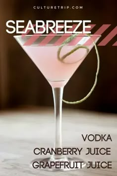 a pink drink in a martini glass with a straw garnish on the rim and text seabreeze vodka cranberry juice grapefruit juice