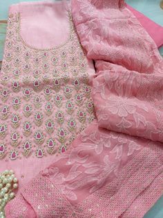 Item Overview ATHARVA Hand Embroidered Salwar Kameez w/Embroidered Neck in Pink/Full Embroidered Georgette Dupatta/Custom Stitching/Wedding/Bridal/ Dno. CH1451 Fabric: * Shirt Chanderi Silk 2.5 Mts, Pink- Embroidered Neck * Dupatta: Georgette Embroidered Dupatta-Hot Pink 2.5 Mts * Bottom Santoon Silk 2.5 Mts. Excusive Hand Embroidered Party Wear Punjabi Suit. Customization: * Fabrics Customization: Designs Can be made in different Fabrics. * Color Customization: Designs Can be made in different Embroidered Sets For Wedding And Diwali, Pink Chanderi Dress With Intricate Embroidery, Designer Unstitched Suit With Intricate Embroidery For Festive Season, Semi-stitched Sets With Intricate Embroidery For Transitional Season, Fitted Embroidered Chinon Salwar Kameez, Semi-stitched Bollywood Sets With Intricate Embroidery, Festive Embroidered Georgette Set, Bollywood Semi-stitched Sets With Intricate Embroidery, Wedding Kurta With Resham Embroidery In Chinon