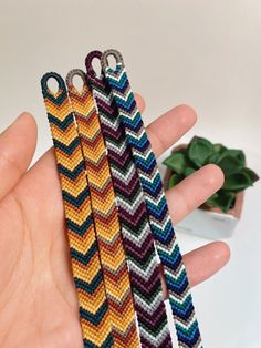 three bracelets that have been made with different colors