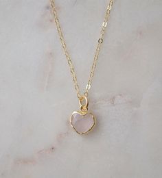 Looking for a unique accessory for some self love, or love for that special someone? Crafted from 14k gold filled and natural Rose Quartz, this pendant is the perfect, sparkling way to show anyone how much you care. Rose Quartz is a stone of love. It is believed to restore trust & harmony in relationships and encourage unconditional love. It purifies the heart and promotes self love, inner healing, and friendship. It is an alternate birthstone for January, as well as the spiritual birthstone for Delicate 14k Gold Jewelry For Valentine's Day, Feminine Round Pendant Jewelry Gift, Feminine Pendant Jewelry Gift, Delicate Jewelry As A Valentine's Day Gift For Her, Delicate Jewelry For Valentine's Day Gift, Delicate Jewelry Gift For Her On Valentine's Day, Delicate Valentine's Day Jewelry Gift For Her, Rose Gold Charm Necklace With Birthstone For Mom, Feminine Rose Gold Charm Necklaces Gift