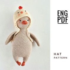 a crocheted stuffed animal with a hat on it's head and legs