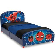 a blue bed with spiderman headboard and foot board