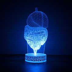 a blue light that is shaped like a brain and an apple on top of it