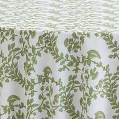 an image of a table cloth with green leaves on the top and bottom part of it