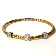 Classique Diamond Cable Bangle Bracelet Charriol Au750 Steel 3mm Gold Tone PVD Stainless Steel 3 18k White Gold Square Diamond Stations Approx .17 CTW Bead Set Diamonds Locking Magnetic Clasp Closure Exact Size & Fit As Shown Measured Excellent Preowned Condition Gold Cable Color Is Brighter Than Images Depict Worn Alone Or Stacked With Others Shown With Matching Single Station Bracelet Authenticity Guaranteed Listing Images Are Of The Actual Item Being Offered Free Shipping Within The United States Elegant Gold Bracelets With Single Cut Diamonds, Luxury Flexible Bangle For Anniversary, Flexible Luxury Bangle For Anniversary, Luxury Gold Diamond-cut Bracelet, Luxury Flexible Gold Diamond Bracelet, Luxury Gold Bangle For Anniversary, Luxury Yellow Bracelets For Anniversary, Luxury Adjustable Bangle For Anniversary, Luxury Gold Diamond Bracelet With Single Cut Diamonds