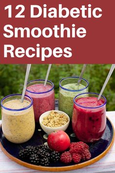 some smoothies are on a plate with strawberries and raspberries in them