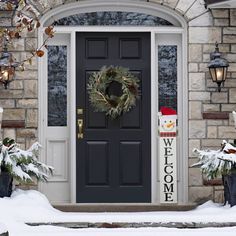 a christmas decoration is on the front door of a house