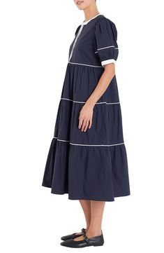 Contrast piping accentuates the tiered skirts and puff sleeves of this breezy cotton midi dress. Hidden-button half placket Band collar Short sleeves Lined 100% cotton Hand wash, dry flat Imported Cotton Midi Dress With Ruffle Hem, Chic Cotton Tiered Midi Dress, Cotton Midi Dress With Ruffle Hem And Short Sleeves, Elegant Tiered Cotton Midi Dress, Cotton Midi Tiered Dress With Ruffle Hem, Tiered Cotton Midi Dress With Ruffle Hem, Modest Mouse, English Factory, Tiered Skirts