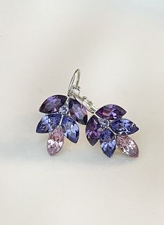 Gorgeous pair of leaf earrings featuring Swarovski 8x4mm marquise crystals shades of cool purples.  So pretty!  Shown in the silver metal finish. Earrings are 1 inch long as shown, 3/4 inch long in the post-back version.  Please select style from the drop down menu at checkout. Thanks for stopping by! Mauve Earrings, Earrings Bridesmaid, Purple Ombre, Autumn Wedding, Swarovski Crystal Earrings, Wedding Jewelry Earrings, Swarovski Earrings, Leaf Earrings, Star Earrings