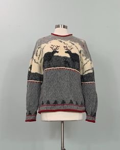 B E S T  F I T S    Suggested Size: 10/12  Please check measurements below to ensure the best possible fit.      D  E  S  C  R I  P  T  I  O  N     *Gray, beige, red, and dark green winter cable knit sweater  *Winter snow scene pattern includes deer/moose, trees, mountains, and snowflakes  *Rolled crew neckline, sleeve cuffs, and hemline  *Pullover   *There is some stretch to the fabric  *Item is not lined  *Winter time theme  *Hand knitted  *Estimated era: 1990s - 00s      D  E  T  A  I  L  S     *Fabric: 85% Wool, 10% Lambswool, 5% Nylon  *Care: Dry clean  *Marked Size: Large  *Maker's Label: Jones New York Sport    M  E  A  S  U  R  E  M  E  N  T  S     (Measurements are taken flat across the front, then doubled when appropriate.)   *Underarm to underarm: 42"  *Waist: 42"  *Hips: 44"  * Scene Pattern, Deer Sweater, Winter Deer, Winter Knit Sweater, Gray Winter, Winter Scene, Pullover Sweater Women, Grey And Beige, Winter Knits