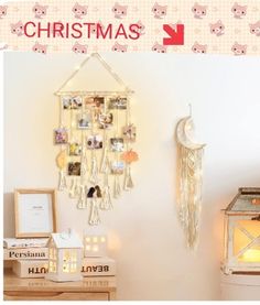 there is a christmas card hanging on the wall next to a lamp and other items