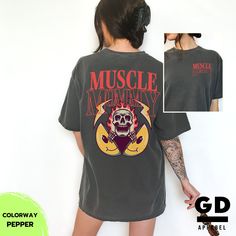 "💚 Welcome to G O L D E N D U S K A P P A R E L 💚 Make a style statement with our exclusive MUSCLE MOMMY TIGER FLAMES PUMP COVER GYM pocket tee on the Comfort Colors 1717 Adult Unisex Heavyweight T-shirt. Designed in a heritage fit with dropped shoulders to give that desired vintage look and style of the garment. This garment-dyed, soft-washed tee provides a vintage aesthetic and a soft, welcoming feel for everyday comfort. DETAILS - 6.1 oz., Heavyweight - Fit: Relaxed  - Style: Unisex Adult (available in sizes S-XXL) - Sizing: Runs true to size. Refer to the Size Guide and Size Chart images. Note: Unisex adult sizing falls between men's and women's traditional sizing. So, a unisex large would be bigger than a woman's large but smaller than a man's large. For women, we suggest ordering a Graphic Print Muscle Tee For Streetwear, Short Sleeve Graphic Muscle Tee, Oversized Graphic Gym T-shirt, Oversized Graphic Print T-shirt For Gym, Trendy Cotton T-shirt For The Gym, Oversized Graphic Print Top For Gym, Oversized Letter Print T-shirt For Workout, Trendy Oversized T-shirt For Workout, Fitness Mom