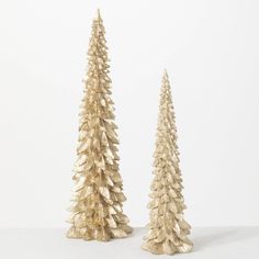 "Metallic Gold Tree Set of 2 | 14\", 18.5\" Tall Christmas Tree | Glam Christmas Decor Set of 2 -Tall sculpted tabletop trees in golden metallic hues with textured detailing, and a sprinkling of glitter. They're perfect for adding that shimmering touch to your seasonal home decor. Sculpted of resin, providing durable, quality pieces to last for years to come. Dimensions: 5\"L x5\"W x18.5\" 4.5\"L x4.5\"W x14.25\" Material: Polyresin Set of 2" Woodland Christmas Decor, Tall Christmas Trees, Glam Christmas Decor, Rustic Holiday Decor, Glam Christmas, Diy Party Supplies, Cone Christmas Trees, Christmas Tree Set, Glitz And Glamour