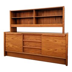 a wooden cabinet with drawers and shelves on it's sides, against a white background