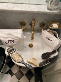 a bathroom sink filled with personal care items