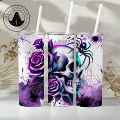 two tumbles with skulls and roses on them, one has a straw in it