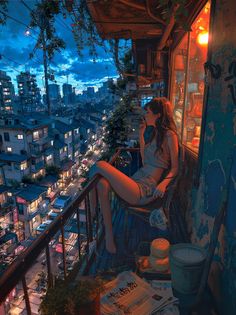 a woman sitting on top of a balcony talking on a cell phone at night with city lights in the background