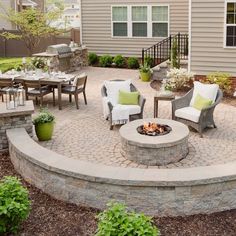 an outdoor patio with seating and fire pit