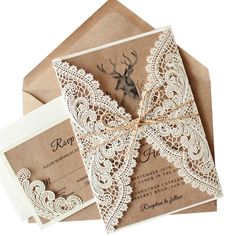 wedding stationery with lace and deer on it