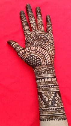 a henna tattoo on the palm of someone's hand