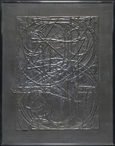 an art work with black and silver paint on the inside of it, in a frame