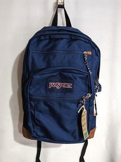 Carry all your essentials in this classic JanSport Cool Student backpack. PRODUCT FEATURES Dedicated 15" padded laptop compartment Two large main compartments Ergonomic S-curve shoulder straps Front utility pocket with organizer Fully padded back panel Side water bottle pocket Pleated front stash pocket Zippered front stash pocket Web haul handle PRODUCT DETAILS Zipper closure 17.5"H x 13"W x 10"D Polyester NOTE:  All items listed in our store are 100% authentic/original, they come from their ow Jansport Blue Backpack, Backpack With A Lot Of Pockets, Navy Jansport Backpack Aesthetic, Navy Jansport Backpack, Dark Blue Jansport Backpack, Navy Blue Jansport Backpacks, Jan Sport Backpacks Aesthetic, Blue Jansport Backpacks, Navy Blue Jansport