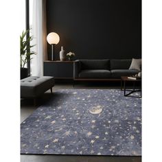 a living room with black walls and stars on the rug in front of the couch