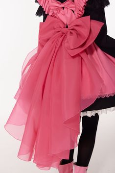 Cardcaptor Sakura inspired three-piece set featuring a black long-sleeve dress, a hot pink apron dress, and a matching bow train.  The black dress boasts elegant long sleeves with layered cap lace sleeves, a high neck, and a delicate white lace hemline. The hot pink apron dress is adorned with a pleated bodice, flutter shoulder straps, and a self-tie sash. Complete the look with the two-layered big bow at the back waist, featuring an organza train for an extra touch of charm.  Black Dress Size Chart:   	 		 			Size 			S 			M 			L 			XL 		 		 			Full Length (White lace trim not included) 			86 			88 			90 			92 		 		 			Bust 			89 			93 			97 			101 		 		 			Waist (Elastic Waist) 			67-80 			71-84 			75-88 			79-92 		 	   Pink Apron Size Chart:   	 		 			Size 			S 			M 			L 			XL 		 		 			F The Black Dress, Steampunk Fashion Female, Pink Apron, Steampunk Fashion Male, Gothic Skirts, Purple Blouse, Pleated Bodice, Apron Dress, Big Bow