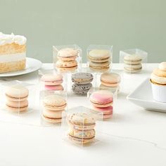 a table topped with lots of different types of macaroons