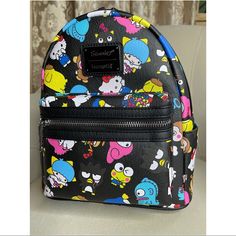 New! Loungefly Hello Kitty Sanrio Rainbow All Over Print Mini Backpack Material: Faux Leather Measurements: W 9" X H 10.5" X D 4.5" Wipe Clean Imported Playful Black Backpack For Everyday Use, Cute Leather Backpack, Cute Black Leather Bag, Black Kawaii Backpack For Everyday Use, Playful Black Bag For Everyday Use, Fun Black Shoulder Bag For Travel, Playful Black Bags For Everyday Use, Fun Black Standard Backpack, Fun Black Bags For Back To School