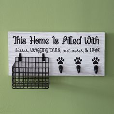 a sign that says this home is filled with kisses, wagging tails, and love