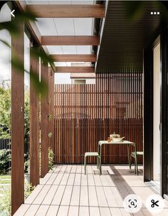 an outdoor patio with wooden slats and tables