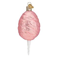 a pink lollipop ornament hanging from a string