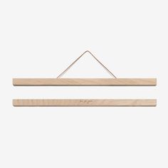 two wooden clothes hangers on a white background