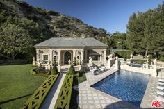 a house with a pool in the front yard