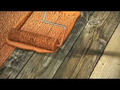 a close up of a wooden floor with a rug on the ground and a roller attached to it