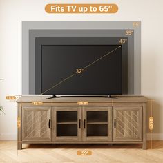 a flat screen tv sitting on top of a wooden cabinet