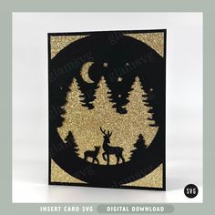 an image of a card with gold glitter on it that has a deer and trees in the background