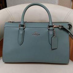 This Is A Beautiful Authentic Coach Handbag. Medium Size. Tiffany Blue With Silver Accents. 2 Pockets On Each Side (Outside) Of The Bag. She's So Pretty And Will Bring Many Compliments. Long Purse Strap Included. New Never Used. Formal Blue Coach Satchel, Classic Blue Coach Bag, Tiffany Blue Color, She's So Pretty, Bags Coach, Coach Handbag, Purse Strap, Coach Purse, Tiffany Blue