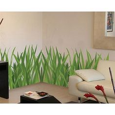 a living room with grass painted on the wall