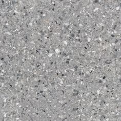 a close up view of an asphalt surface with small rocks and gravel on the ground