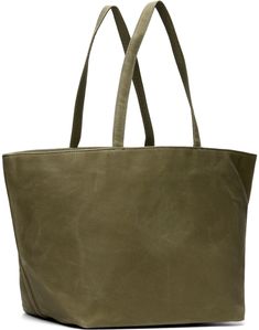 Waxed cotton canvas tote in khaki. · Twin shoulder straps · Logo embossed at face · Self-tie fastening · Patch and zip pocket at interior · Twill lining · H11.75 x W21 x D10 Supplier color: Surplus khaki Green Waxed Finish Tote Shoulder Bag, Waxed Canvas Tote Shoulder Bag, Casual Olive Leather Bag, Casual Tote Shoulder Bag With Waxed Finish, Casual Khaki Bags With Waxed Finish, Casual Khaki Bag With Waxed Finish, Casual Green Bag With Waxed Finish, Khaki Leather Bags With Waxed Finish, Green Leather Shoulder Bag With Canvas Lining