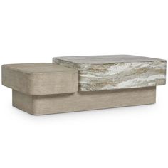 an ottoman that is made out of concrete and has a stone top on the bottom