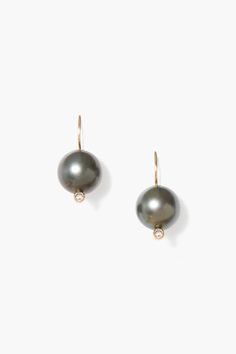 These elegant drop earrings feature black Tahitian pearls accentuated by subtle white diamonds on solid 14k gold French hooks.14k yellow gold, .06ct white diamonds, black Tahitian pearls.1" drop.Handmade in Vietnam. Black Tahitian Pearls, Tahitian Black Pearls, Handmade Box, South Sea Pearls, Sea Pearls, Tahitian Pearls, Pearl Drop Earrings, Black Pearl, Pearl Drop