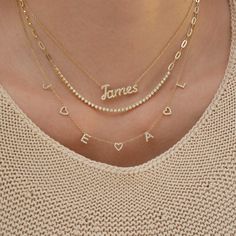 The Diamond Script Name Necklace is the perfect start to any necklace layer. You can choose from 1-10 diamond script letters to create a custom, one-of-a-kind piece that is sure to become your everyday staple. Name Necklace Gold Layered, Pearl Name Necklace, Vertical Name Necklace, Name Necklace Stack, Name Necklace Aesthetic, Necklace Name Design, Diamond Name Necklace, Jewelry Nails, Neck Necklace